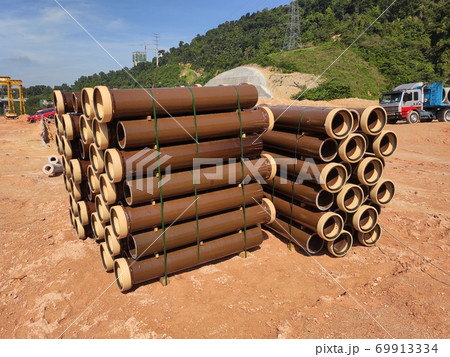 SEREMBAN, MALAYSIA -MARCH 2, 2020: Vitrified clay pipe stacked at the construction site. Commonly used as the sewerage underground pipe. It is lasting and heavy-duty.  69913334