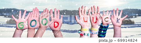 Kids Hands Holding Word Good Luck, Snowy Winter Background Kids Hands Holding Word Good Luck, Snowy Winter Background 69914824