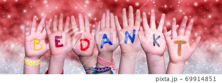 Children Hands Bedankt Means Thank You, Red Christmas Background Children Hands Bedankt Means Thank You, Red Christmas Background 69914851