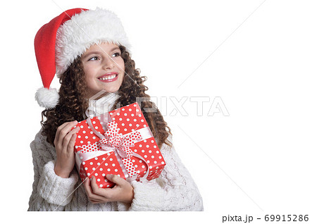 Portrait of smiling little girl with Christmas present Portrait of smiling little girl with Christmas present 69915286