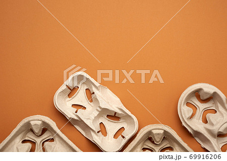 paper tray for drinks in takeaway cups on four cups  on a brown background 69916206