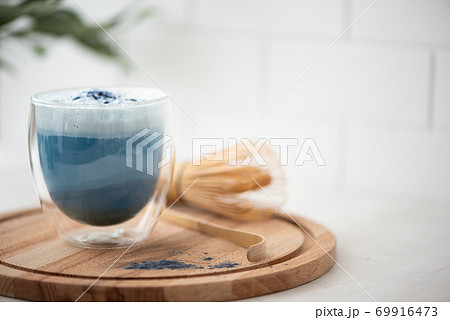blue matcha tea with latte foam in a glass blue matcha tea with latte foam in a glass 69916473