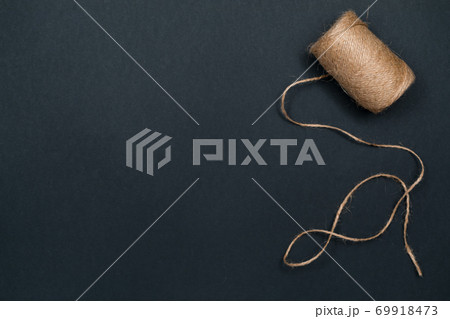 Hemp twine. Natural materials for crafts. Top view with copy space, flat lay. Hemp twine. Natural materials for crafts. Top view with copy space, flat lay. 69918473