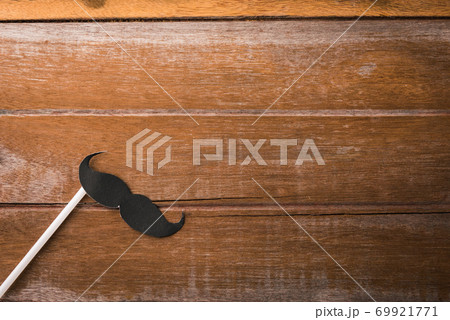 Black mustache paper on wooden 69921771