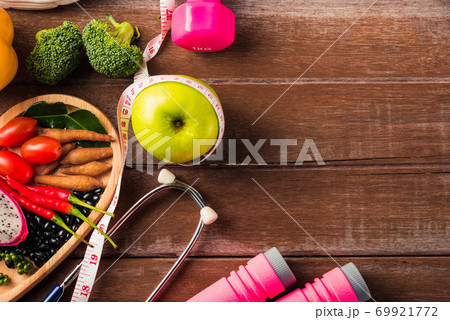fruit and vegetable in heart plate, shoes, sports equipment and doctor stethoscope fruit and vegetable in heart plate, shoes, sports equipment and doctor stethoscope 69921772