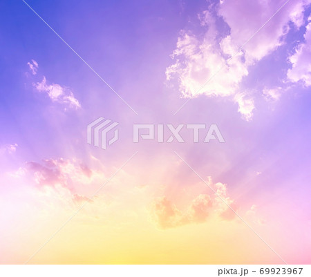 sky and clouds nature background,yellow and orange sunset light on purple blue sky with soft clouds sky and clouds nature background,yellow and orange sunset light on purple blue sky with soft clouds 69923967