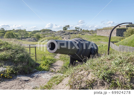 19th century cannon on the seashore in the sea fortress in Suomenlinna, Finland 69924278