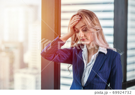 business woman migraine headache from heat, hard work and less rest. business woman migraine headache from heat, hard work and less rest. 69924732
