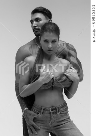 Sexy young couple in studio Sexy young couple in studio 69925351