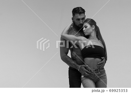 Sexy young couple in studio Sexy young couple in studio 69925353