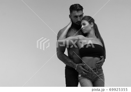 Sexy young couple in studio 69925355