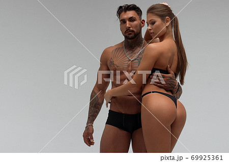 Sexy couple in panties hugging each other Sexy couple in panties hugging each other 69925361