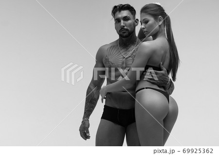 Sexy young couple in studio Sexy young couple in studio 69925362