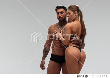 Sexy couple in panties hugging each other Sexy couple in panties hugging each other 69925363