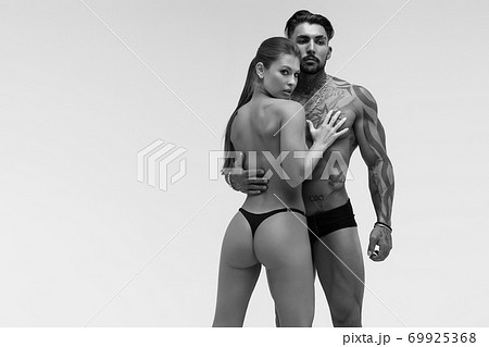 Sexy young couple in studio 69925368