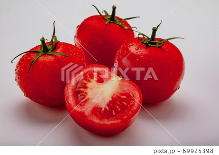 Three wet tomatoes plus one cut 69925398