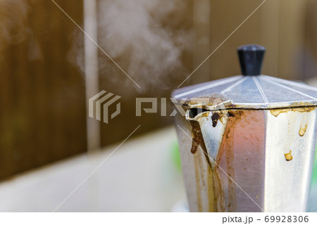 Brewing coffee using an old coffee maker Brewing coffee using an old coffee maker 69928306