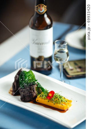 Veal cheeks in wine sauce and sweet potato puree 69933420