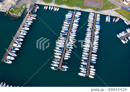 Boats moored at dock in Lovere port Boats moored at dock in Lovere port 69935429