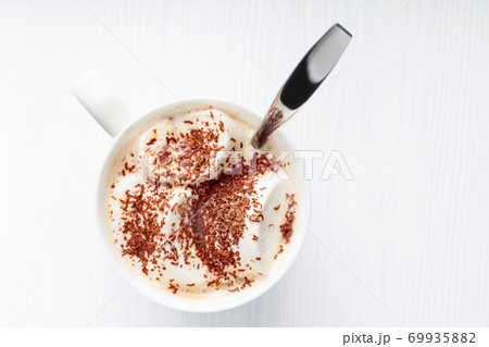 Hot chocolate and marshmallow sprinkled with chocolate chips. 69935882