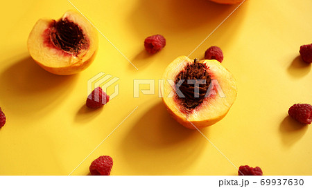Raspberries and peaches for healthy summer eating 69937630
