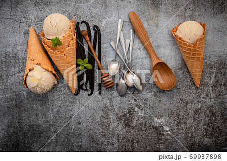 Vanilla ice cream flavor in cones with Vanilla pods setup on concrete background . Summer and Sweet menu concept. 69937898
