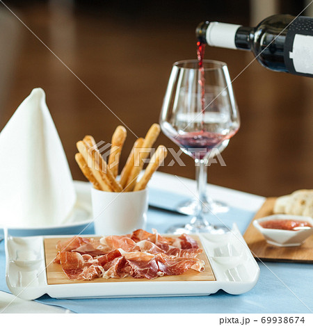 Spanish sliced pork jamon with red wine Spanish sliced pork jamon with red wine 69938674