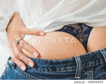 Woman's buttocks and thong, close-up – License image – 71020062