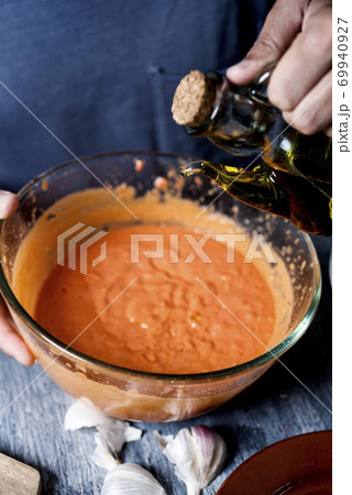 preparing porra antequerana, a cold tomato soup 69940927