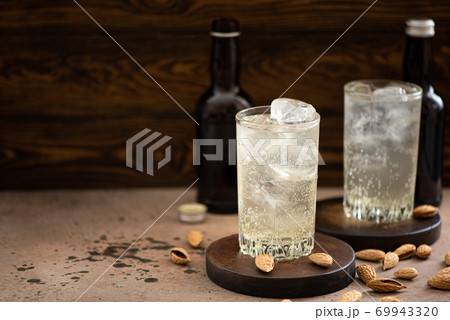 non-alcoholic ginger beer with ice in tall glasses 69943320
