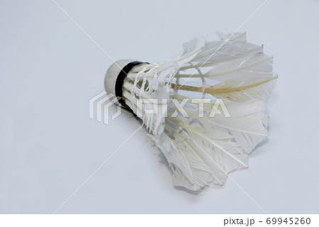 Shabby shuttlecock. Some of the feathers have been damaged and lost. Shabby shuttlecock. Some of the feathers have been damaged and lost. 69945260