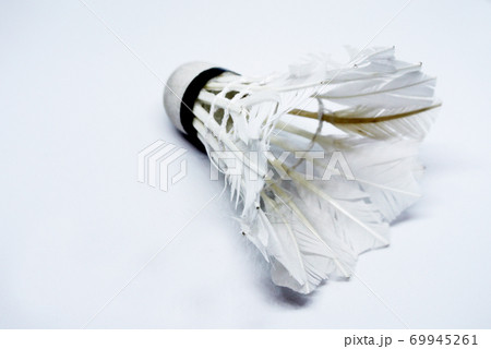 Shabby shuttlecock. Some of the feathers have been damaged and lost. 69945261
