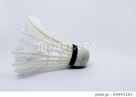 Shabby shuttlecock. Some of the feathers have been damaged and lost. 69945263