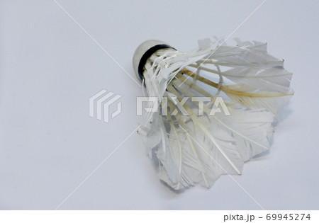 Shabby shuttlecock. Some of the feathers have been damaged and lost. Shabby shuttlecock. Some of the feathers have been damaged and lost. 69945274