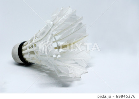 Shabby shuttlecock. Some of the feathers have been damaged and lost. 69945276