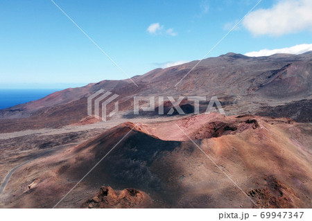 Amazing aerial view of a volcanic crater in El Hierro island, Canary Islands, Spain. 69947347