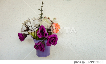 Small decorative dried flowers on the white background Small decorative dried flowers on the white background 69949630