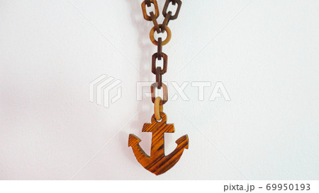 Decorative wooden chain ship anchor symbol on the white background Decorative wooden chain ship anchor symbol on the white background 69950193