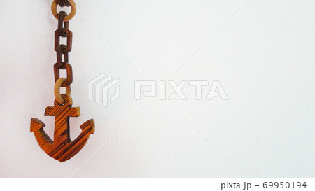 Decorative wooden chain ship anchor symbol on the white background Decorative wooden chain ship anchor symbol on the white background 69950194