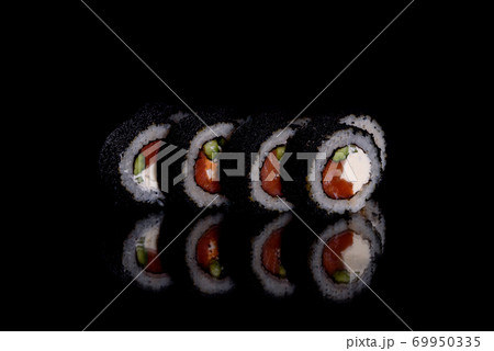 Fresh delicious beautiful sushi rolls on a dark background 69950335