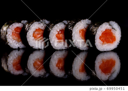 Fresh delicious beautiful sushi rolls on a dark background 69950451