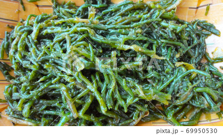 Close-up of fresh boiled sea beans. Turkish and Greek healthy Salicornia olive oil herb salad. 69950530