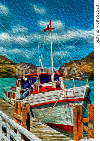 Small boat anchored on pier in a lake 69952523