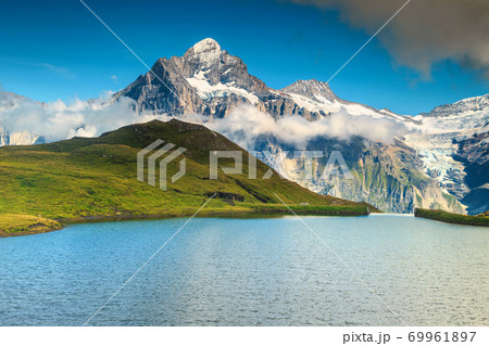 Majestic alpine lake Bachalpsee, Grindelwald, Switzerland, Europe Majestic alpine lake Bachalpsee, Grindelwald, Switzerland, Europe 69961897