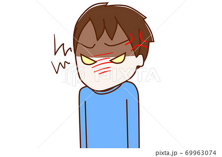 イライラしてキッと睨みつける少年 69963074