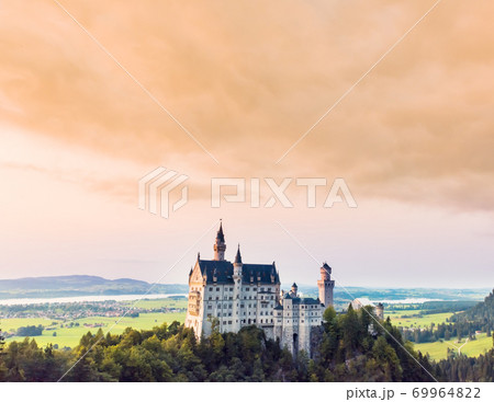 Beautiful aerial view of Neuschwanstein castle in summer season Beautiful aerial view of Neuschwanstein castle in summer season 69964822