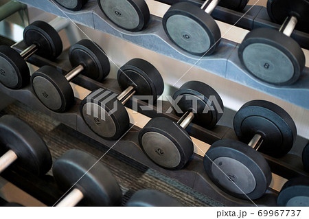 Dumbbell rack in the fitness room Dumbbell rack in the fitness room 69967737