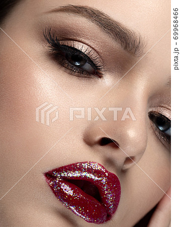 Portrait of young beautiful woman with red lips Portrait of young beautiful woman with red lips 69968466