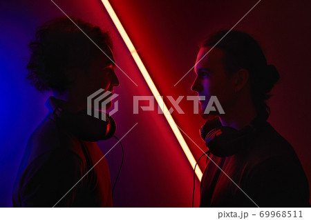 Two gamers in dark room Two gamers in dark room 69968511