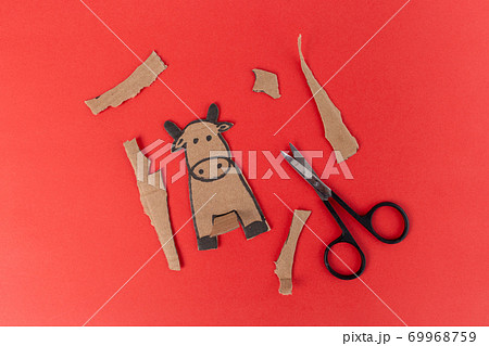 craft cow made of cardboard, craft for small children for a holiday, activity with parents, Paper art character bull cow craft for kids, Animal cardboard figurine, Children play home. Ox year. craft cow made of cardboard, craft for small children for a holiday, activity with parents, Paper art character bull cow craft for kids, Animal cardboard figurine, Children play home. Ox year. 69968759
